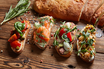 Image showing Set of assorted bruschetta with various toppings for holiday. To