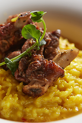 Image showing The ossobuco and saffron risotto. Shallow dof