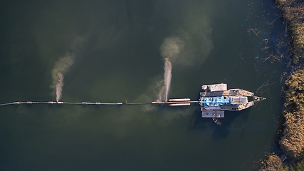 Image showing On the river there are works on extraction of sand. Works dredge