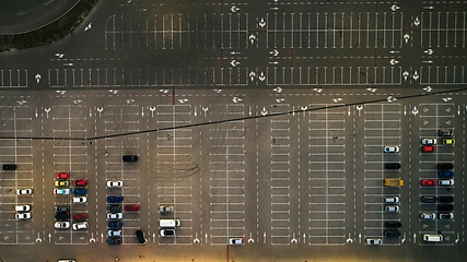 Image showing Aerial top view of parking lot with many cars from above, transportation and urban concept.