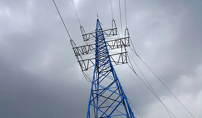 Image showing High voltage tower against the cloudy sky