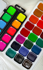 Image showing Bright colorful watercolor paints 