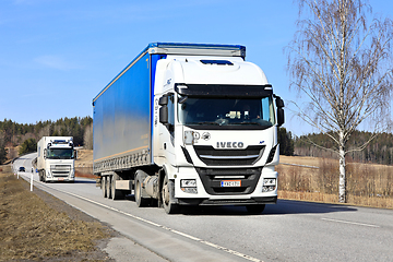 Image showing Freight Transport by Two White Semi Trucks 