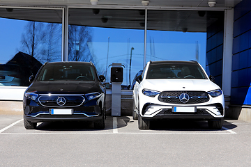 Image showing Two New Mercedes-Benz Cars at a Dealership