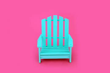 Image showing Trendy Solitary Wooden Chair on Vivid Pink Background 