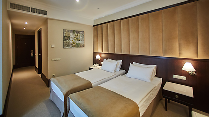 Image showing Two beds in a hotel room. Interior design