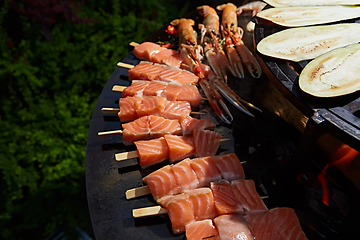 Image showing Grilled fresh seafood: prawns, fish, octopus, oysters food background Barbecue Cooking BBQ