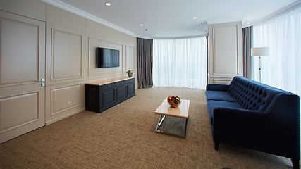 Image showing A modern livingroom inside a new flat with TV.