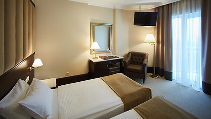 Image showing Two beds in a hotel room. Interior design