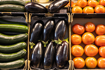 Image showing Colorful organic summer bio vegetables, tomatoes, zucchini and eggplant in boxes being sold on local fruit and vegetables market.