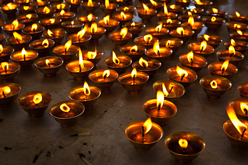 Image showing Burning candles in Buddhist temple. McLeod Ganj, Himachal Pradesh