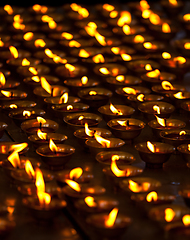 Image showing Burning candles in Buddhist temple. McLeod Ganj, Himachal Prades