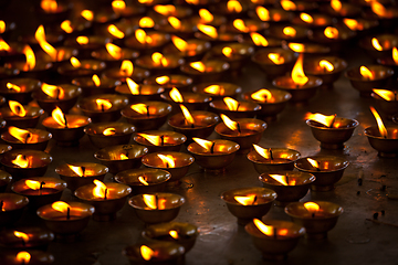 Image showing Burning candles in Buddhist temple. McLeod Ganj, Himachal Pradesh