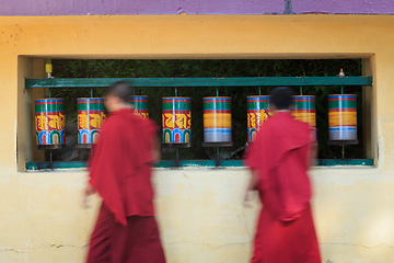 Image showing Buddhist monks rotating prayer wheels in McLeod Ganj