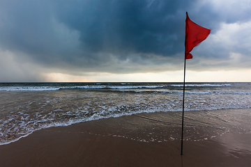 Image showing Storm warning flags on beach. Baga, Goa, India