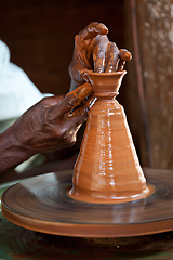 Image showing Potter throwing