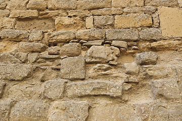 Image showing Very old stone wall texture, close-up architectural background