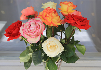 Image showing Bouquet of colorful fading roses 