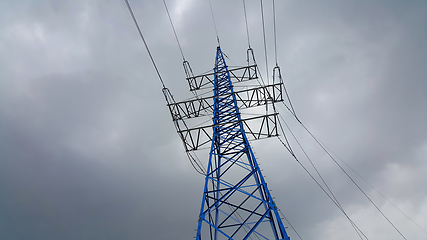 Image showing High voltage tower against the cloudy sky