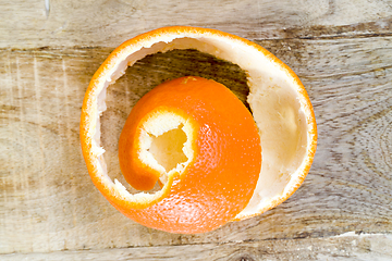 Image showing peeled ripe orange mandarin