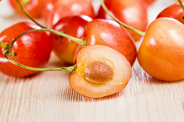 Image showing sliced yellow cherries