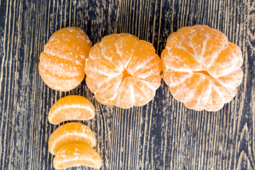 Image showing peeled sweet and juicy tangerine