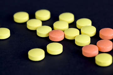 Image showing yellow and orange pills