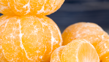 Image showing peeled sweet and juicy tangerine