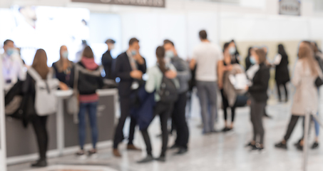 Image showing Abstract blured people at exhibition hall of expo event trade show. Business convention show or job fair. Business concept background.