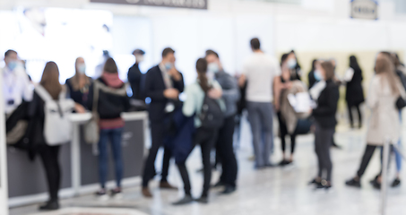 Image showing Abstract blured people at exhibition hall of expo event trade show. Business convention show or job fair. Business concept background.