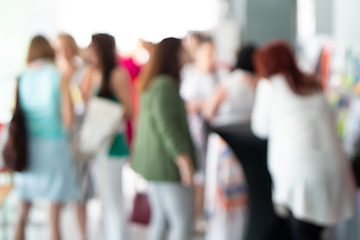 Image showing Blured image of businesspeople at coffee break at conference meeting.