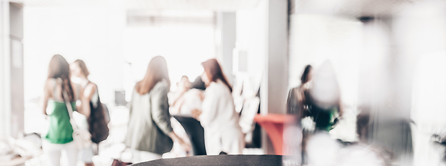 Image showing Blured image of businesspeople at coffee break at conference meeting.