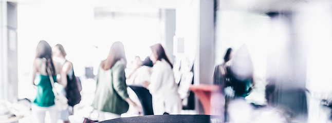 Image showing Blured image of businesspeople at coffee break at conference meeting.