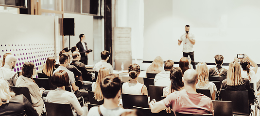 Image showing Business speaker giving a talk at business conference event.