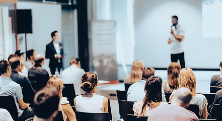 Image showing Business speaker giving a talk at business conference event.