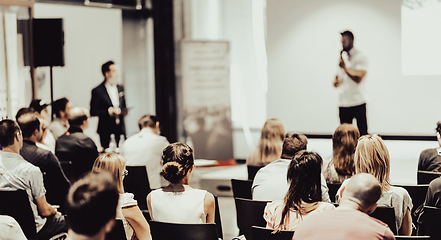 Image showing Business speaker giving a talk at business conference event.