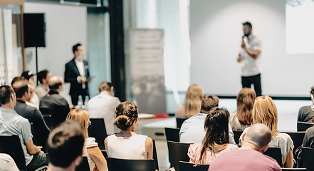 Image showing Business speaker giving a talk at business conference event.