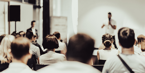 Image showing Business speaker giving a talk at business conference event.