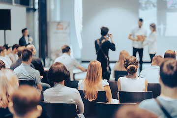 Image showing Business speaker giving a talk at business conference event.