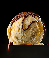 Image showing melted chocolate on vanilla ice cream