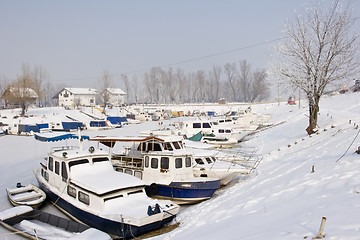 Image showing old boats in frozen marina