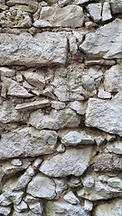 Image showing Very old stone wall, close-up architectural texture