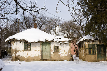 Image showing traditional mud built farmhouse in winter