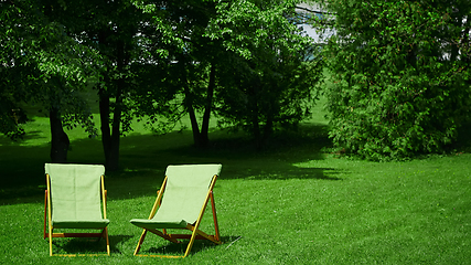 Image showing Two resting chairs in the city park