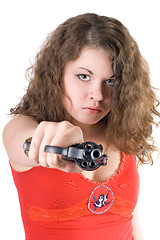 Image showing Young woman with a revolver. Isolated on white background