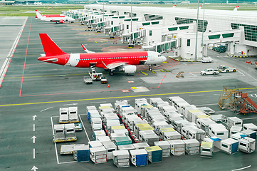 Image showing Airplains and freight containers in airport 