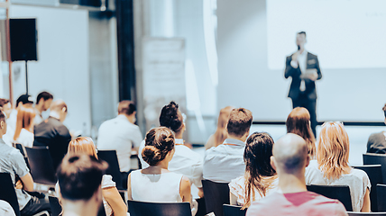 Image showing Business speaker giving a talk at business conference event.