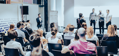 Image showing Business speaker giving a talk at business conference event.