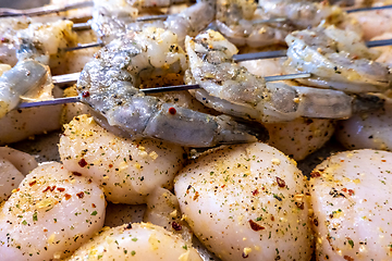 Image showing raw scallops and shrimp prepared for party