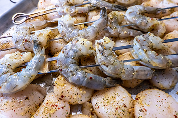 Image showing raw scallops and shrimp prepared for party